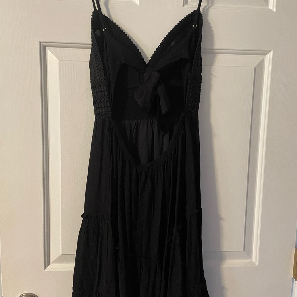 Beautiful, never been worn, black backless dress.